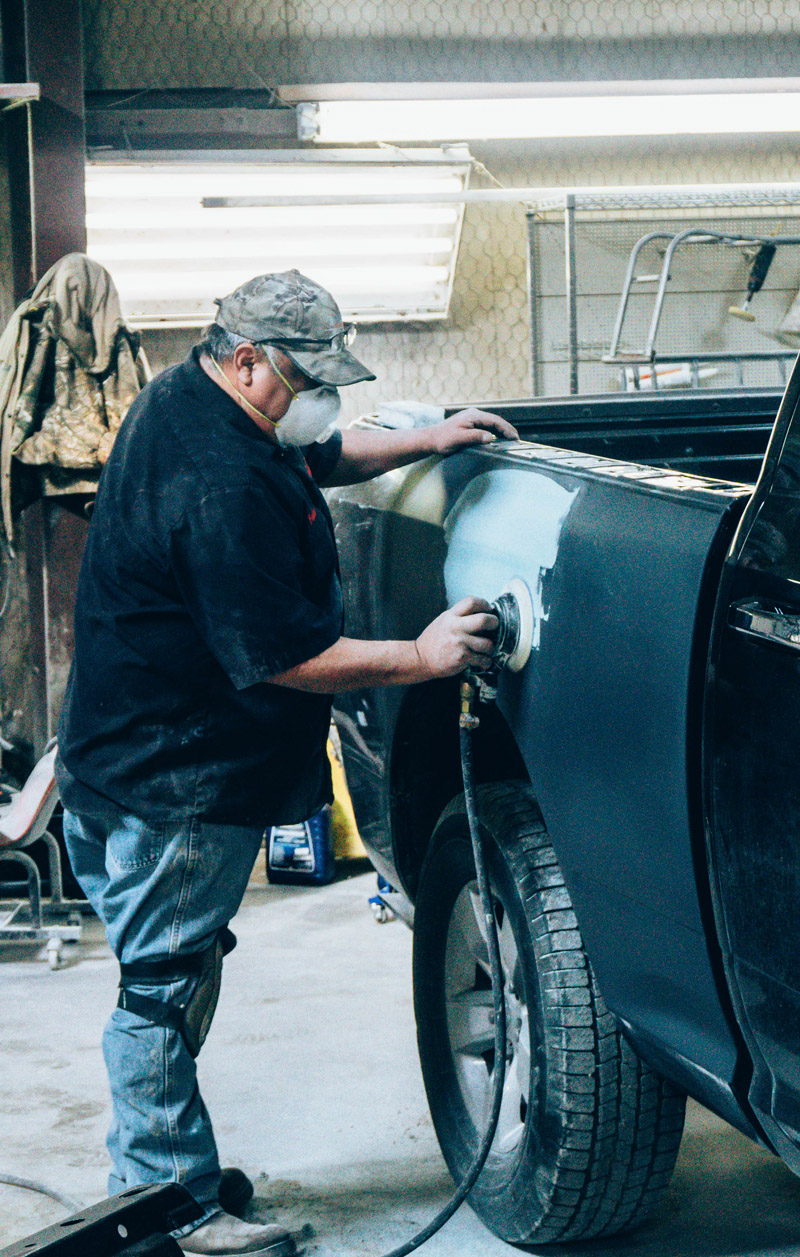 Jace Auto Body technician working on a vehicle repair.